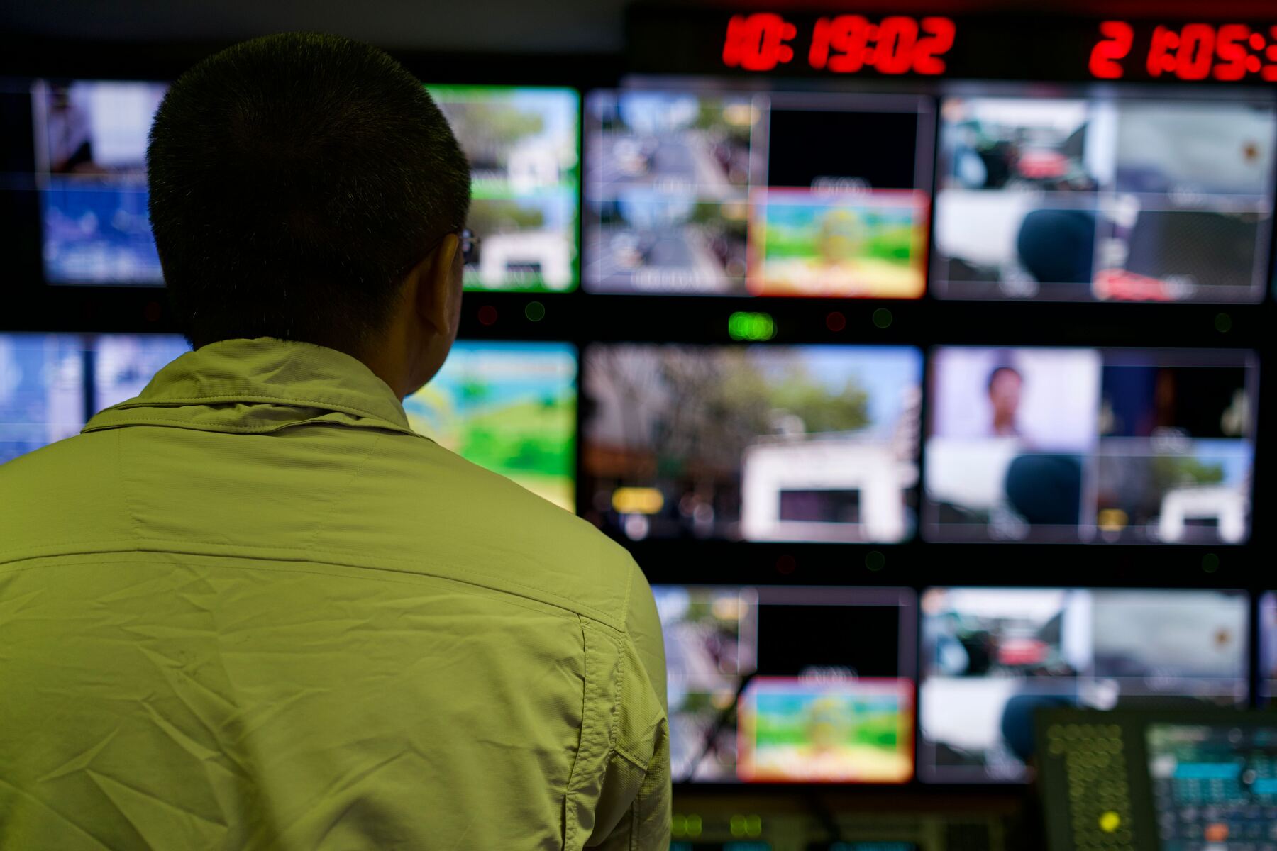 Operations analyst reviewing live monitoring screens
